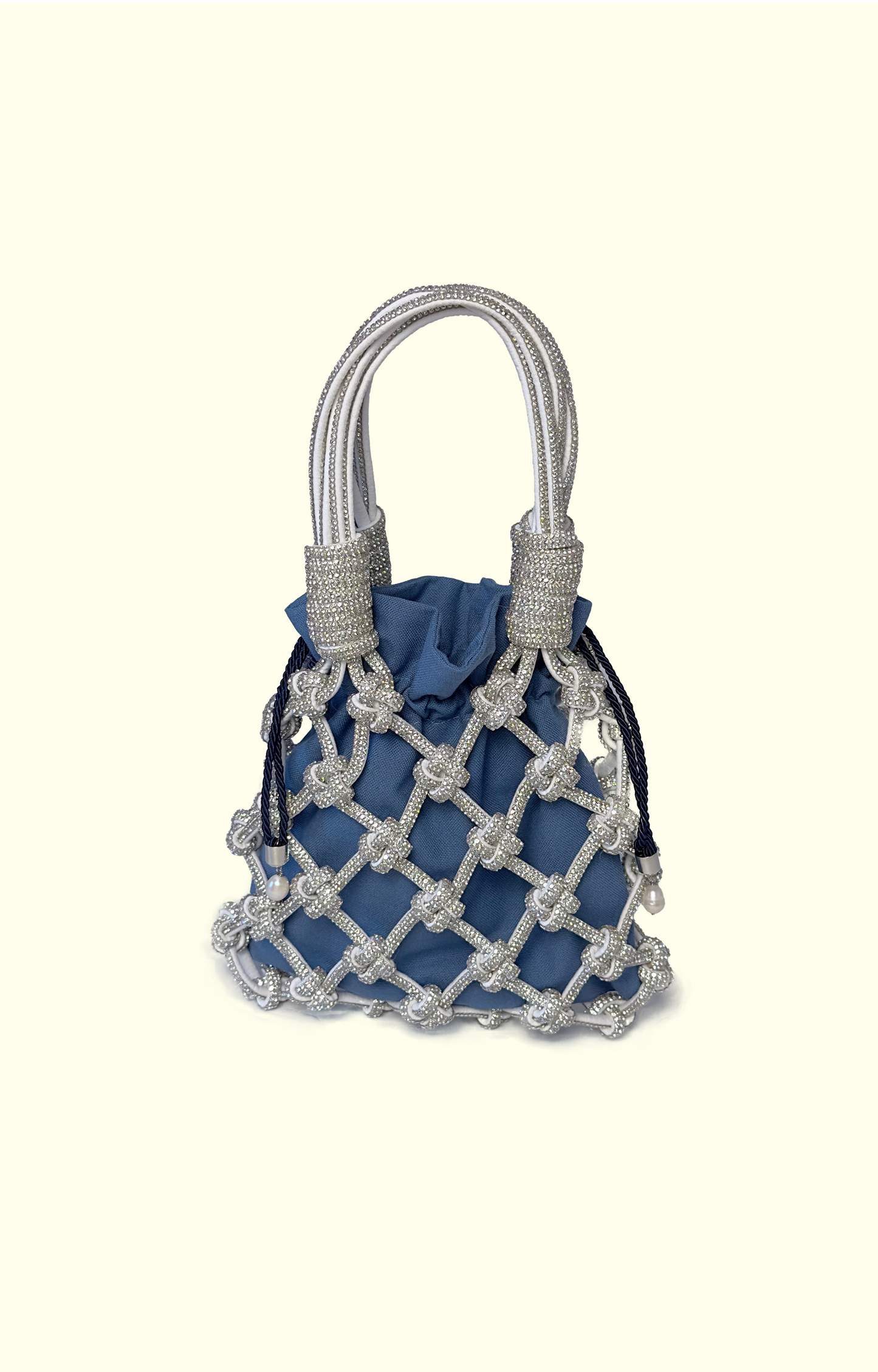 Blue netted handbag with silver handles on a white background