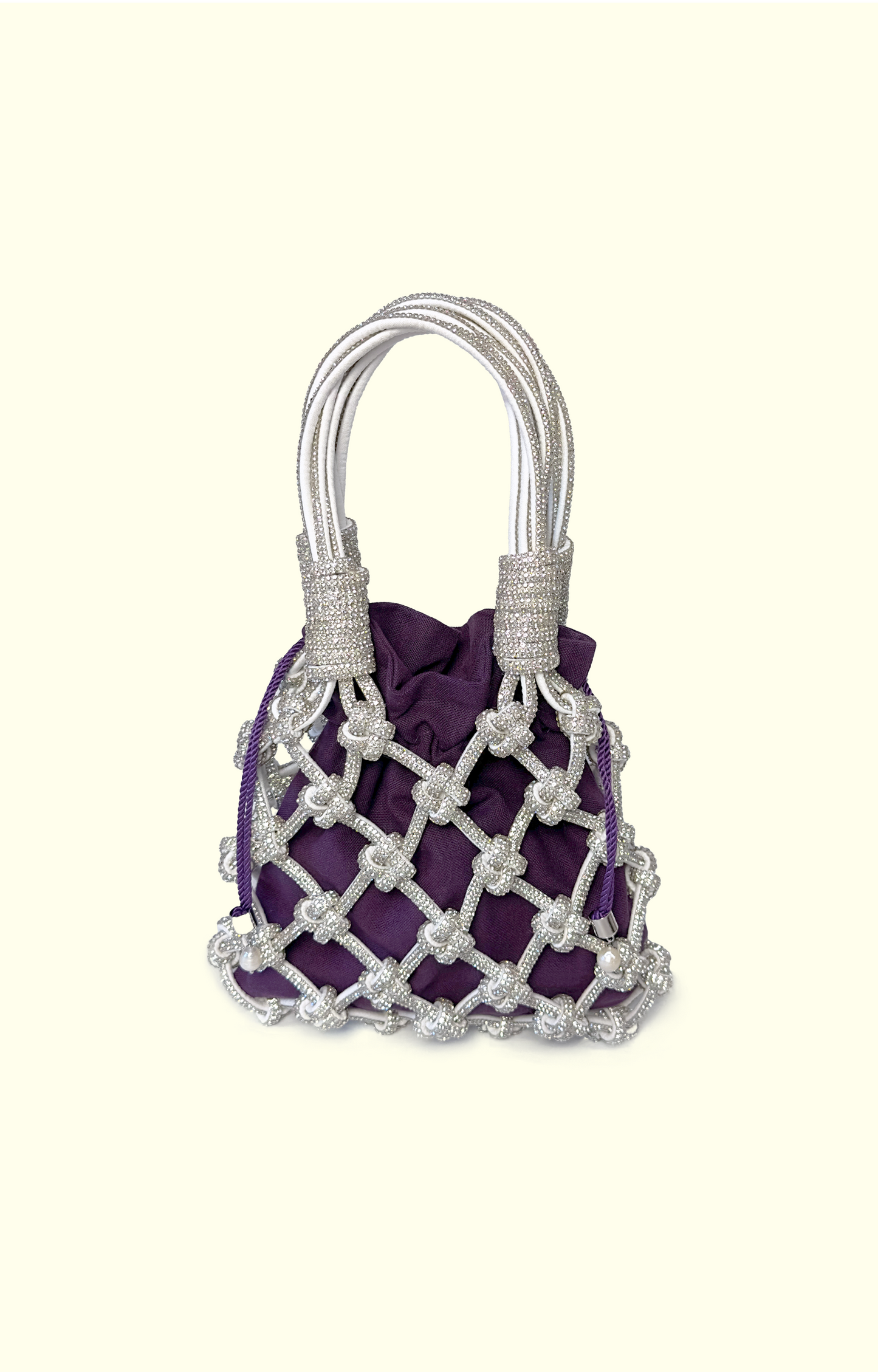 Purple handbag with silver mesh design on a white background