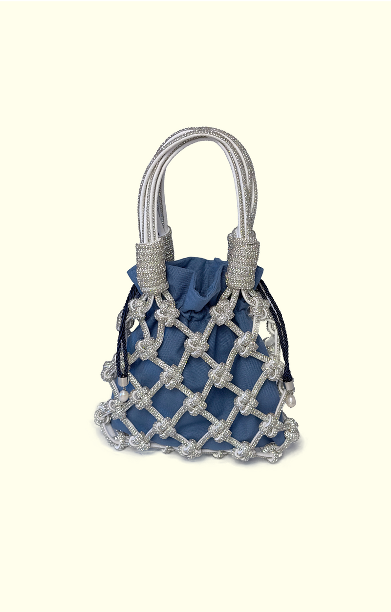 Blue netted handbag with silver handles on a white background
