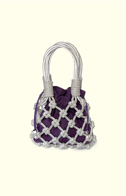 Purple handbag with silver mesh design on a white background