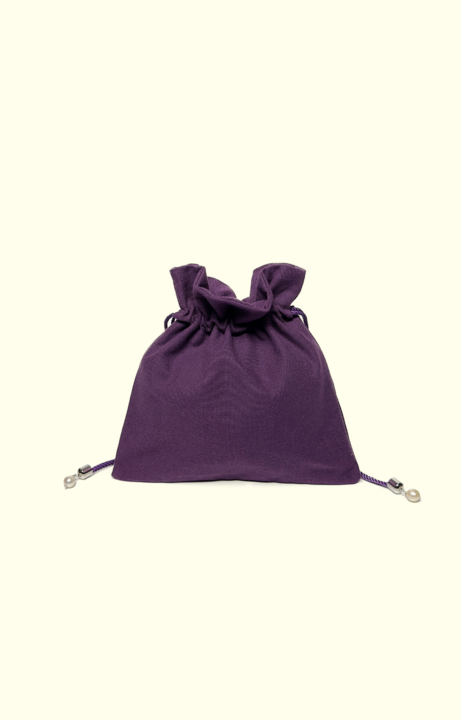 Purple drawstring bag on a white background
