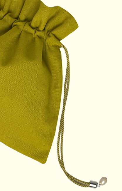 Green drawstring pouch on a white background
