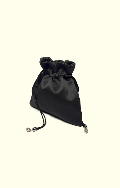 Black satin drawstring pouch on a white background