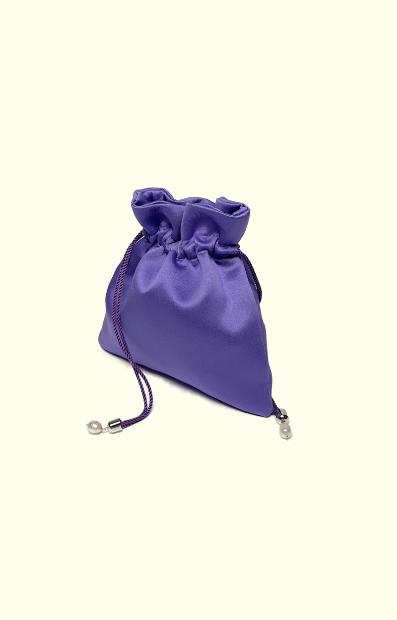 Purple satin drawstring bag on a white background
